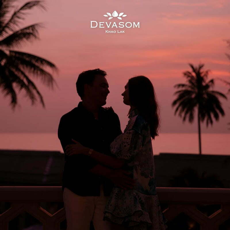 Bask in stunning pink sunset sky as a couple creating loving Valentine's memories.